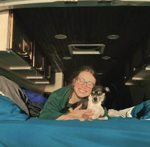 Sara with Brutus in the van